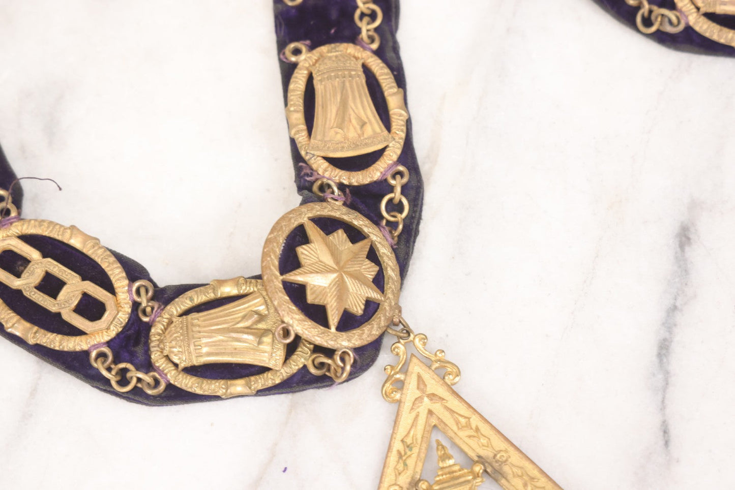 Lot 109 - Grouping Of Four Antique Odd Fellows I.O.O.F.. Purple Chain Collars By Harding Uniform & Regalia Co., Boston, And Fuller Regalia & Costume, Worcester, Massachusetts, With Symbolic Medallions
