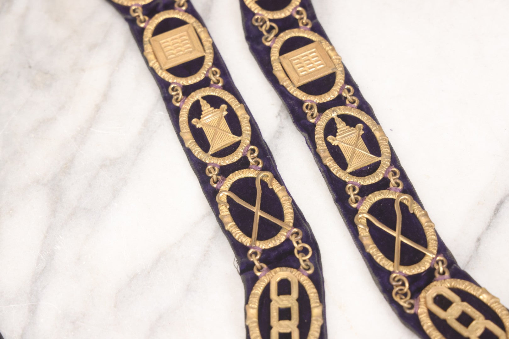 Lot 109 - Grouping Of Four Antique Odd Fellows I.O.O.F.. Purple Chain Collars By Harding Uniform & Regalia Co., Boston, And Fuller Regalia & Costume, Worcester, Massachusetts, With Symbolic Medallions