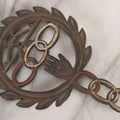 Lot 112 - Vintage Reproduction Cast Iron Odd Fellows I.O.O.F.. Trivet With Three Links, F.L.T., And Heart-In-Hand, Marked Wilton, Circa Mid-20th Century