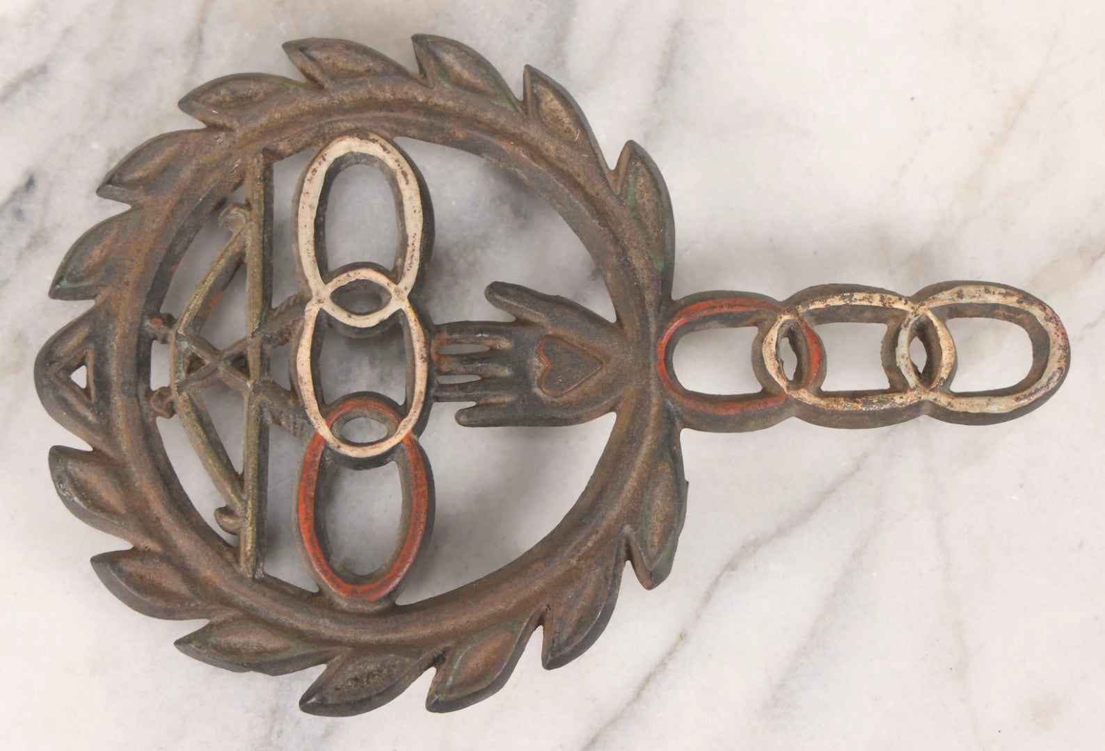 Lot 112 - Vintage Reproduction Cast Iron Odd Fellows I.O.O.F.. Trivet With Three Links, F.L.T., And Heart-In-Hand, Marked Wilton, Circa Mid-20th Century