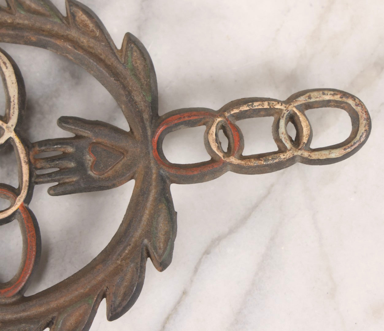 Lot 112 - Vintage Reproduction Cast Iron Odd Fellows I.O.O.F.. Trivet With Three Links, F.L.T., And Heart-In-Hand, Marked Wilton, Circa Mid-20th Century