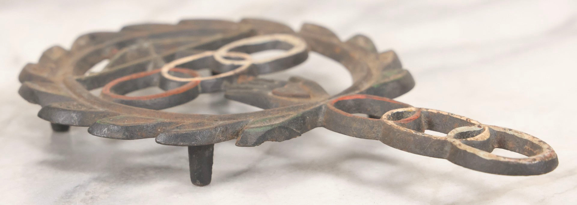 Lot 112 - Vintage Reproduction Cast Iron Odd Fellows I.O.O.F.. Trivet With Three Links, F.L.T., And Heart-In-Hand, Marked Wilton, Circa Mid-20th Century