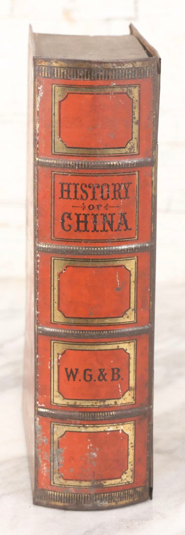 Lot 117 - Antique Tin Lithograph Book Safe In The Form Of Book Titled "History Of China," Marked "W.G. & B." On Spine