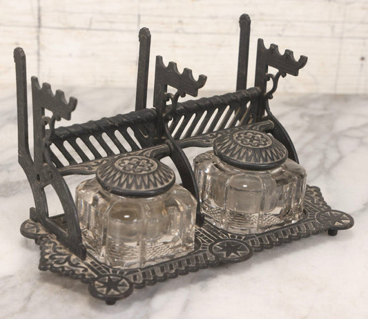 Lot 120 - Antique Cast Iron Double Inkwell Stand With Ornate Geometric And Star Decoration, Integrated Lids, Pen Rests, And Letter Holder, With Original Glass Inkwells, Vintage Black Paint Restoration