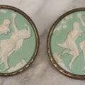 Lot 127 - Pair Of Antique Brass-Mounted Jasperware-Style Hatpins Or Brooches With Dancing Classical Figures, Woman With Cup And Man Playing Flute