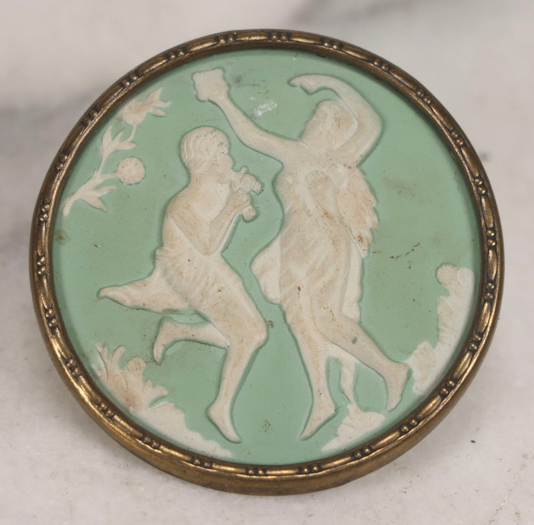 Lot 127 - Pair Of Antique Brass-Mounted Jasperware-Style Hatpins Or Brooches With Dancing Classical Figures, Woman With Cup And Man Playing Flute