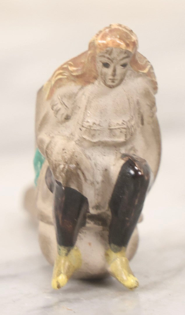 Lot 132 - Antique Painted Clay Figural Pipe Of A Busty Blonde Woman Sitting On A Chamber Pot, Stamped L. Fiolet, St. Omer, France, Note Stem Broken, 3-1/8" L