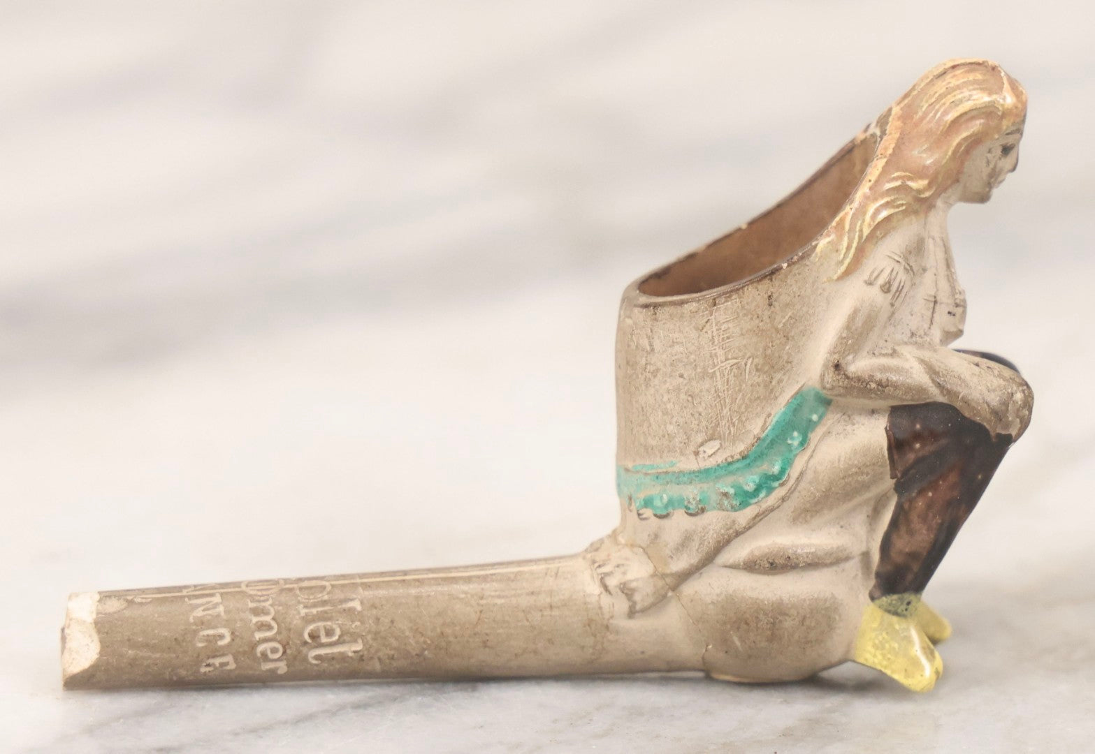 Lot 132 - Antique Painted Clay Figural Pipe Of A Busty Blonde Woman Sitting On A Chamber Pot, Stamped L. Fiolet, St. Omer, France, Note Stem Broken, 3-1/8" L