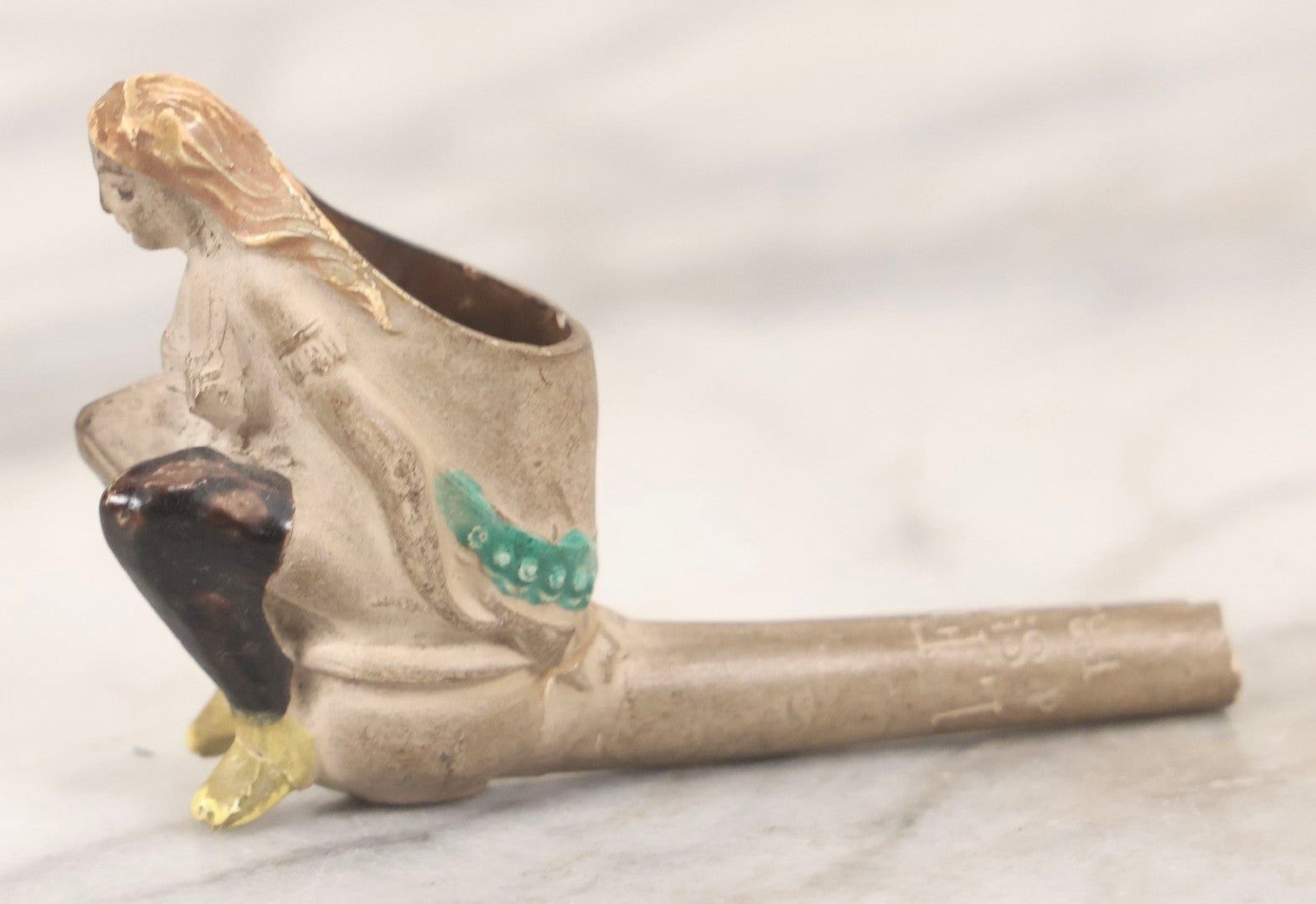 Lot 132 - Antique Painted Clay Figural Pipe Of A Busty Blonde Woman Sitting On A Chamber Pot, Stamped L. Fiolet, St. Omer, France, Note Stem Broken, 3-1/8" L