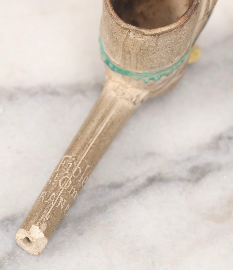 Lot 132 - Antique Painted Clay Figural Pipe Of A Busty Blonde Woman Sitting On A Chamber Pot, Stamped L. Fiolet, St. Omer, France, Note Stem Broken, 3-1/8" L