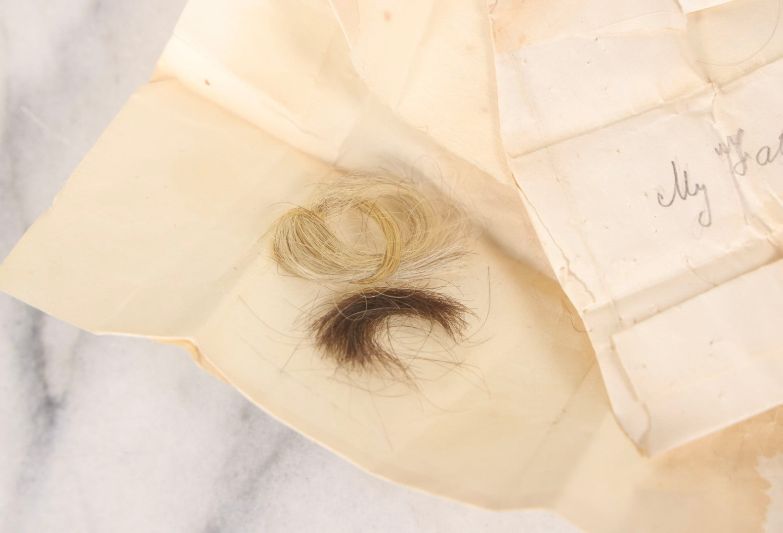 Lot 137 - Antique Hair Relics Including Braid With Inscribed Paper Label “My Father's Hair, In 1848… Oct 23rd 1880” And Folded Paper Containing Two Curls Of Hair