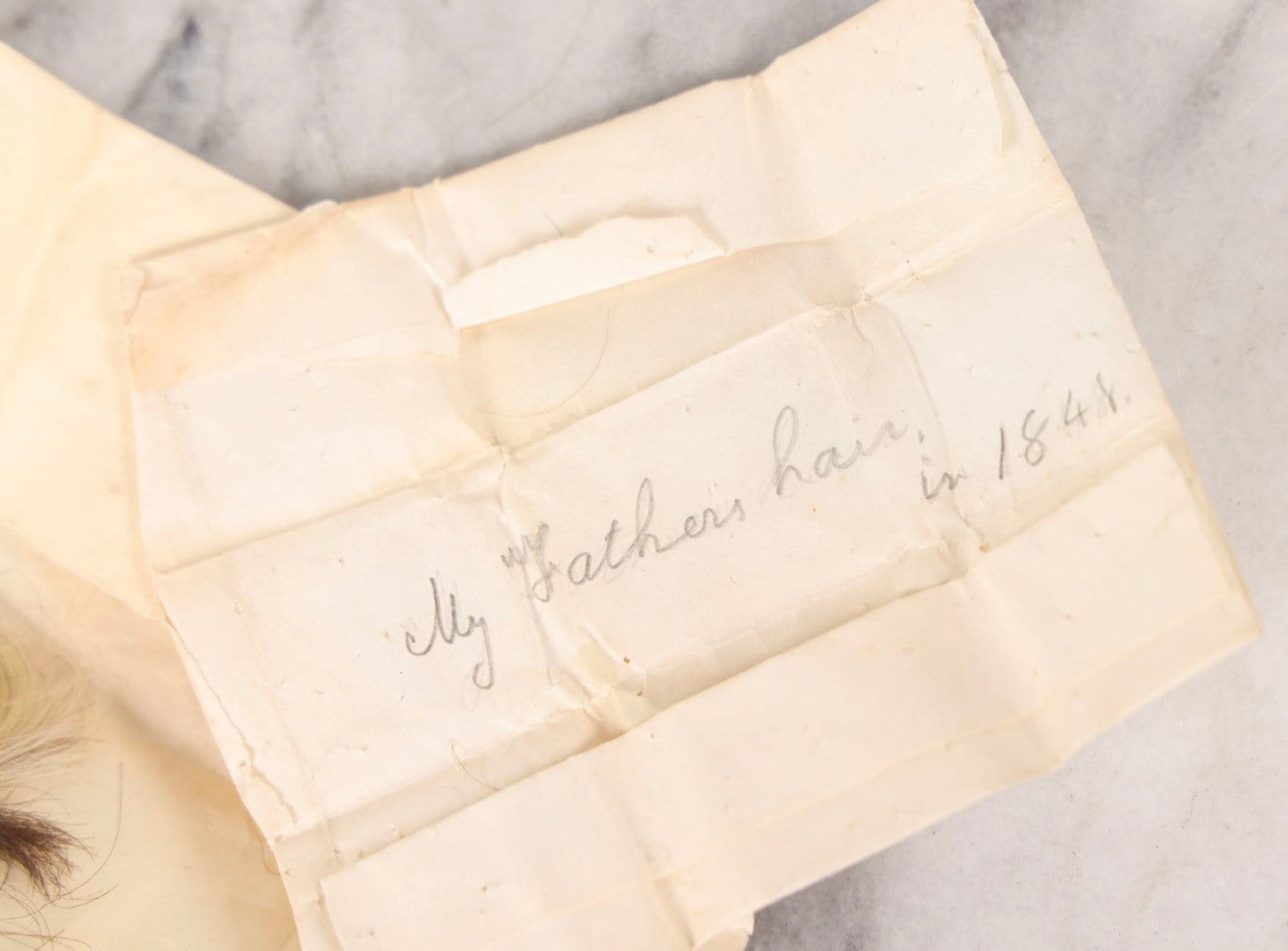Lot 137 - Antique Hair Relics Including Braid With Inscribed Paper Label “My Father's Hair, In 1848… Oct 23rd 1880” And Folded Paper Containing Two Curls Of Hair