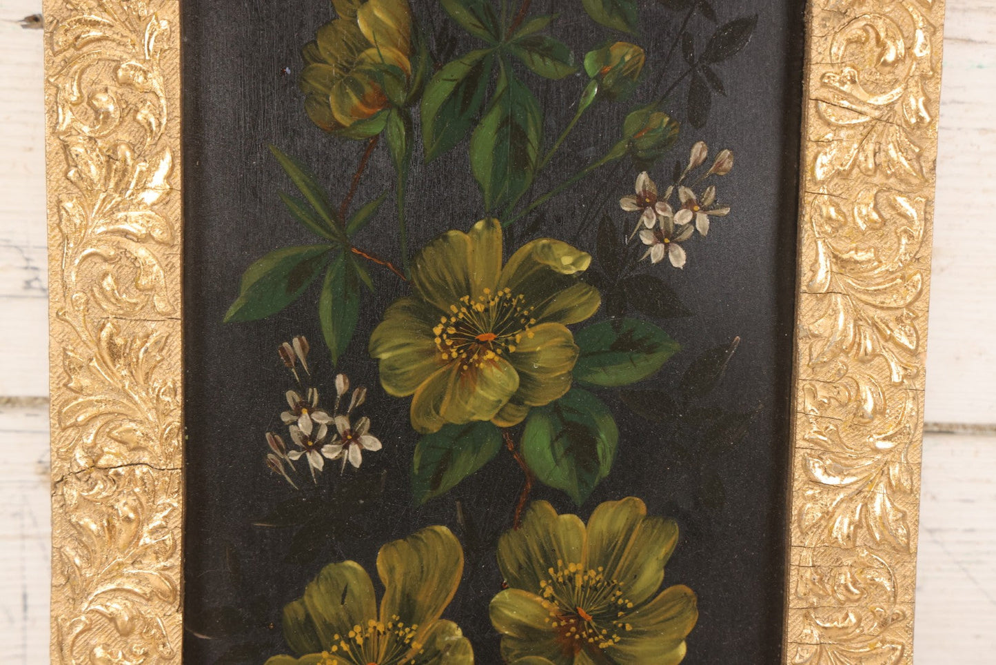 Lot 144 - Antique Oil On Board Painting Of Yellow And White Flowers On Black Background On Tin, In Gilt Wood Frame With Leaf Design, 9-3/8" x 22-1/4"