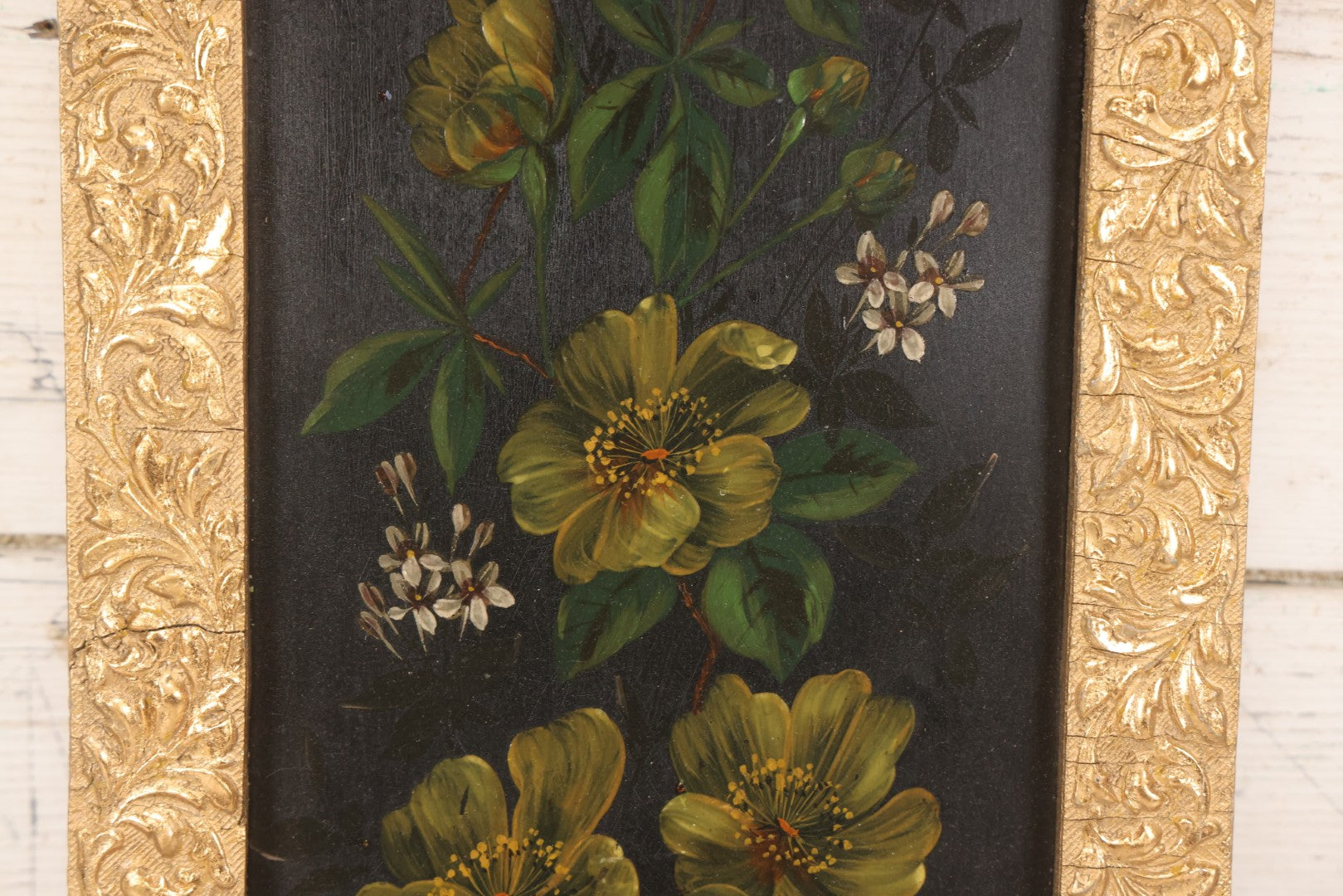 Lot 144 - Antique Oil On Board Painting Of Yellow And White Flowers On Black Background On Tin, In Gilt Wood Frame With Leaf Design, 9-3/8" x 22-1/4"