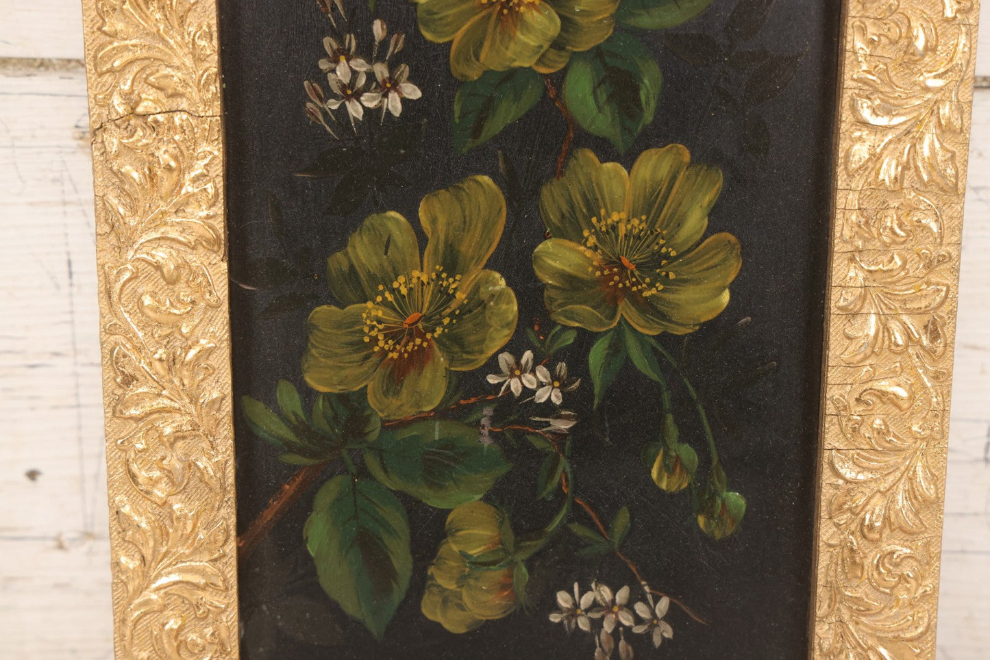 Lot 144 - Antique Oil On Board Painting Of Yellow And White Flowers On Black Background On Tin, In Gilt Wood Frame With Leaf Design, 9-3/8" x 22-1/4"