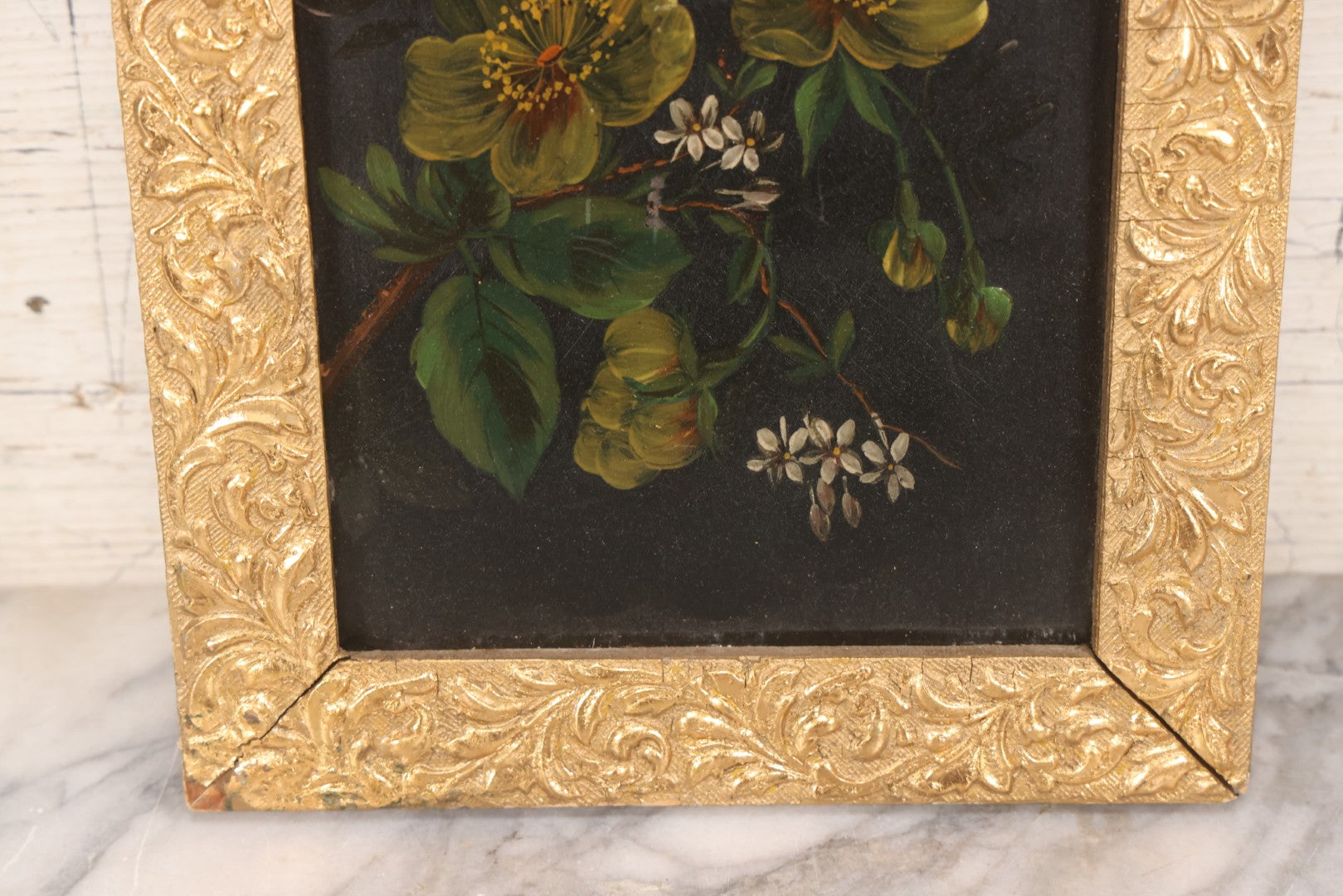 Lot 144 - Antique Oil On Board Painting Of Yellow And White Flowers On Black Background On Tin, In Gilt Wood Frame With Leaf Design, 9-3/8" x 22-1/4"
