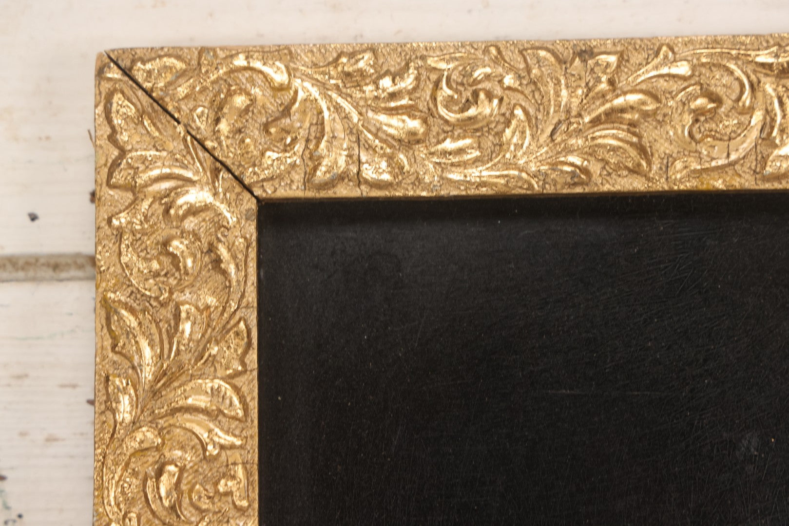 Lot 144 - Antique Oil On Board Painting Of Yellow And White Flowers On Black Background On Tin, In Gilt Wood Frame With Leaf Design, 9-3/8" x 22-1/4"