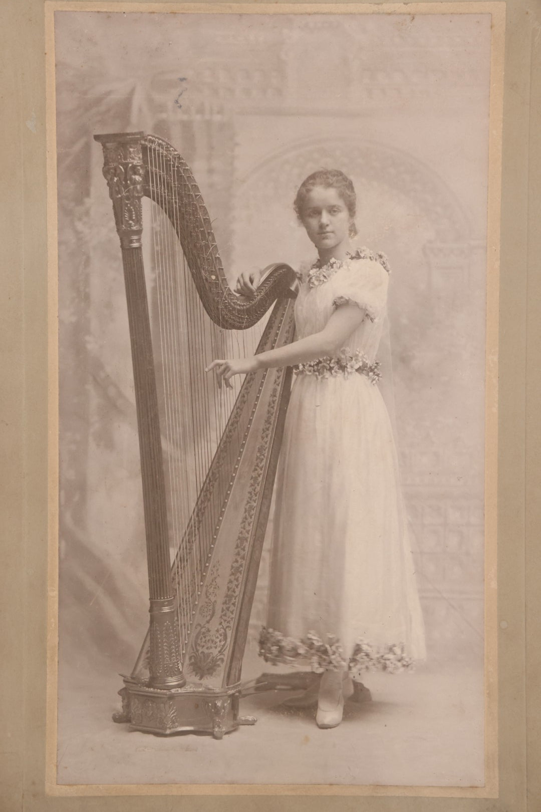 Lot 154 - Antique Boarded Photograph Of Young Girl In White Dress Playing Ornate Harp, Photographed By Belsmith, Cincinnati, Ohio