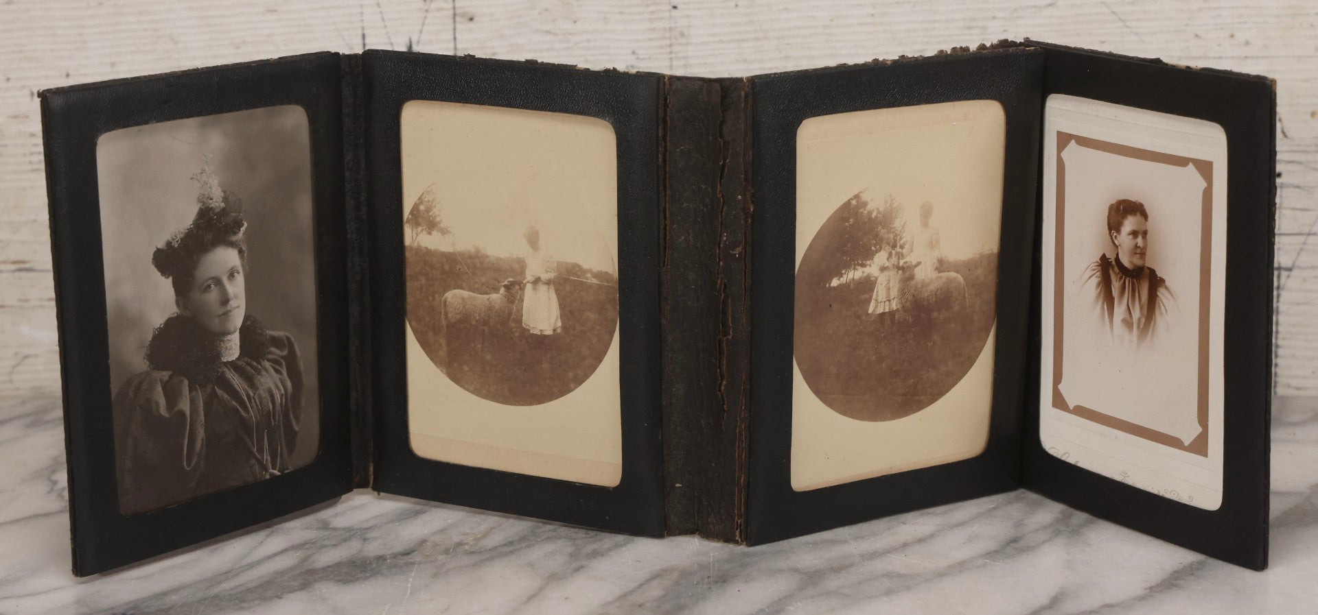 Lot 157 - Antique Quad-Fold Leatherette Photo Folder Wallet With Four Cabinet Card Photographs, Including Woman's Portraits And Children With Lamb
