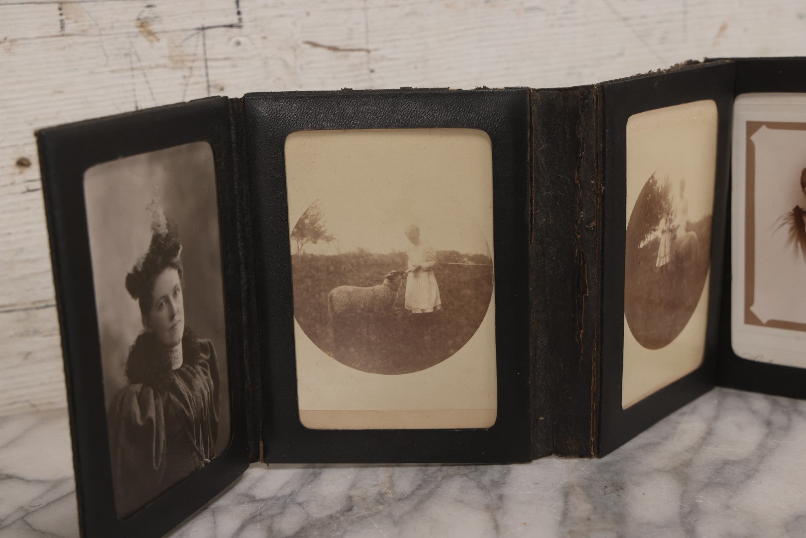 Lot 157 - Antique Quad-Fold Leatherette Photo Folder Wallet With Four Cabinet Card Photographs, Including Woman's Portraits And Children With Lamb