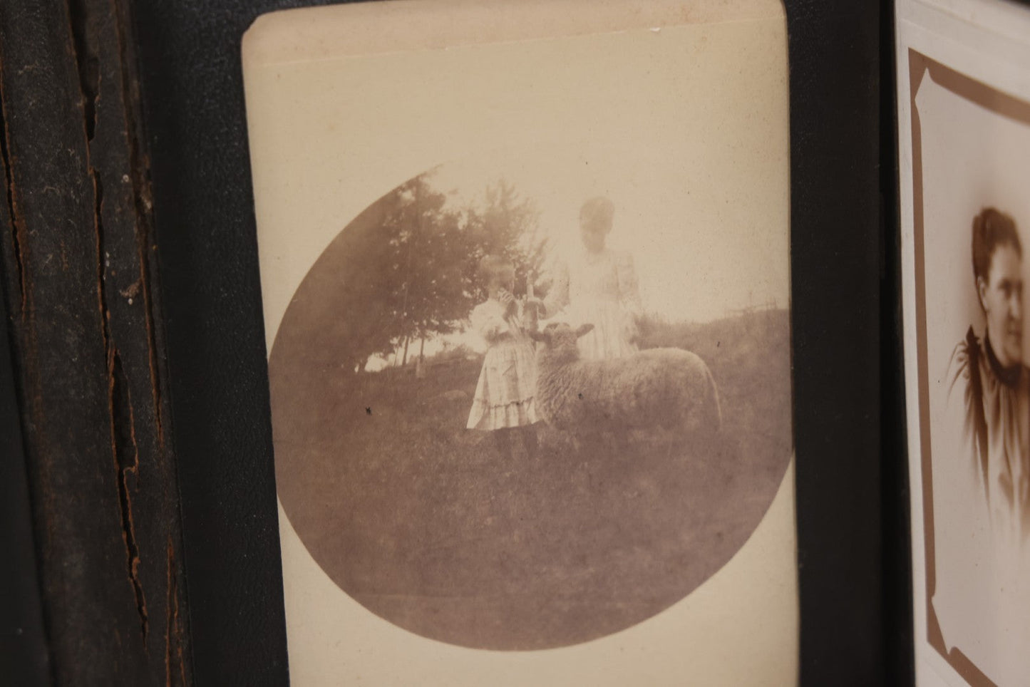 Lot 157 - Antique Quad-Fold Leatherette Photo Folder Wallet With Four Cabinet Card Photographs, Including Woman's Portraits And Children With Lamb