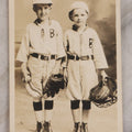 Lot 162 - Antique Real Photo Postcard R.P.P.C.. Of Two Young Boys In Baseball Uniforms With Glove, Ball, And Catcher's Mask, Undivided Back