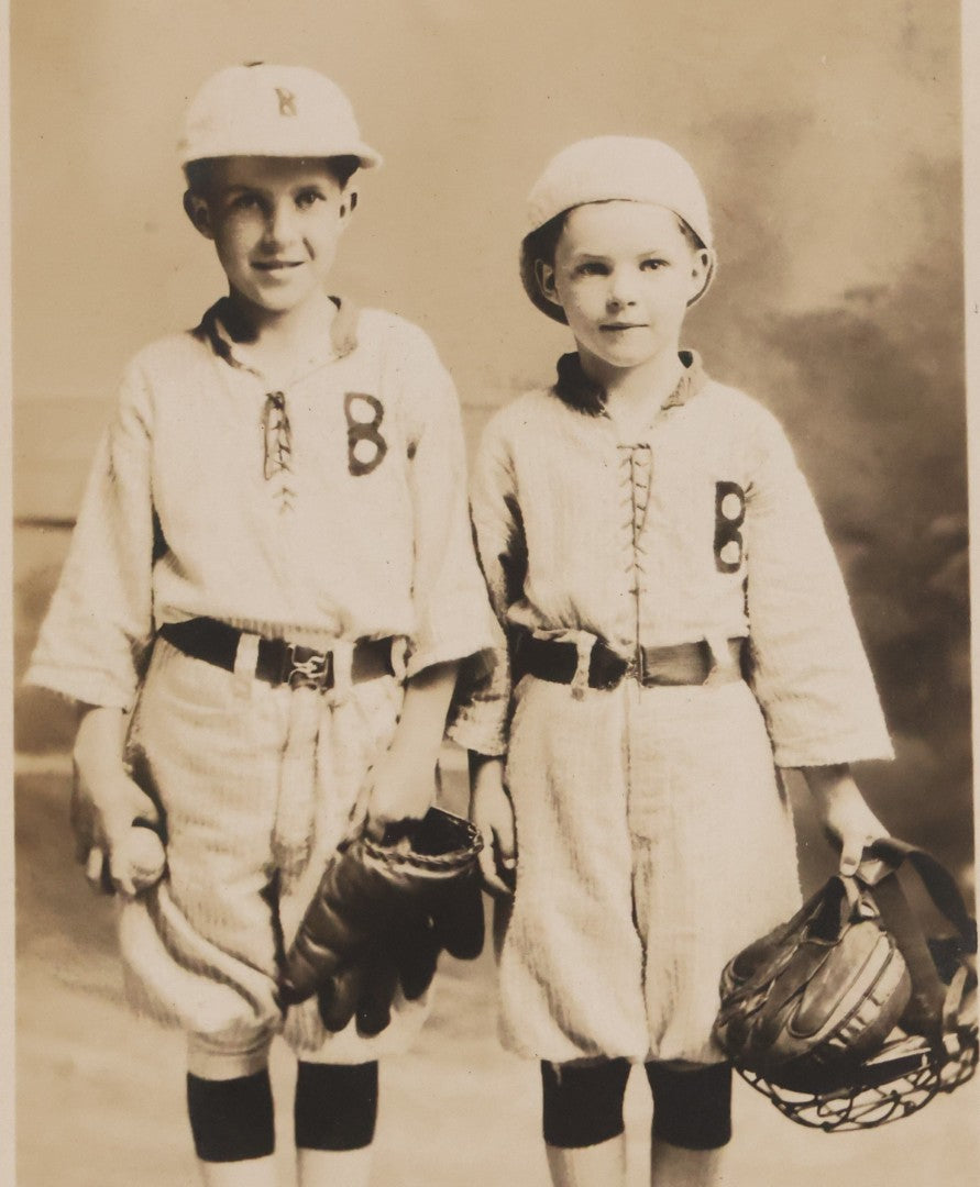 Lot 162 - Antique Real Photo Postcard R.P.P.C.. Of Two Young Boys In Baseball Uniforms With Glove, Ball, And Catcher's Mask, Undivided Back