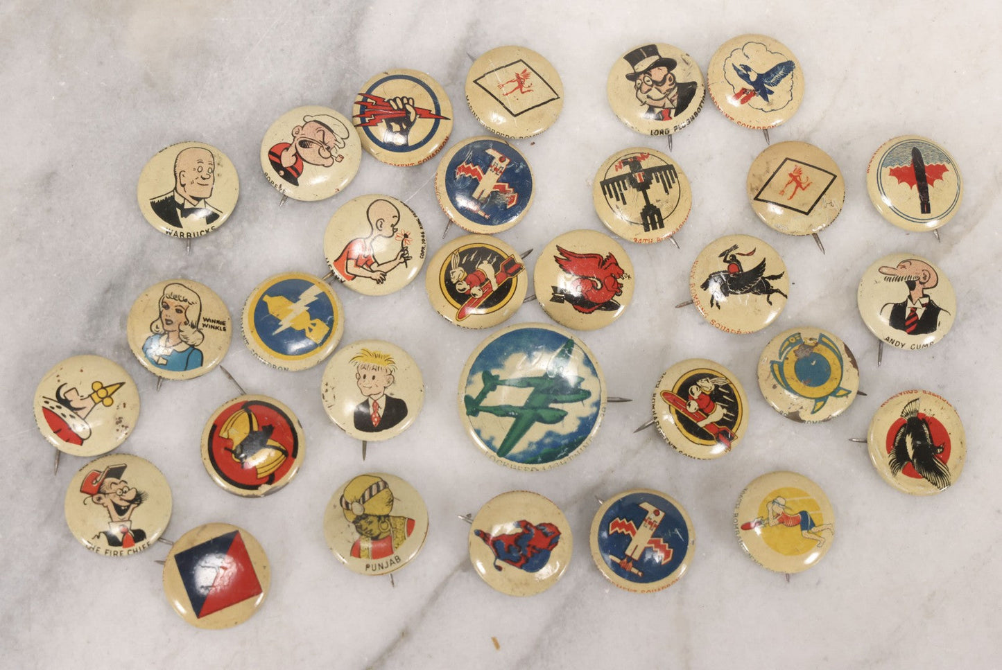 Lot 187 - Grouping Of 30 Vintage Kellogg's Pep Cereal Pinback Buttons Featuring Comic Strip Characters Like Popeye And Lord Pushbottom And World War II Military Insignia, Copyright 1946