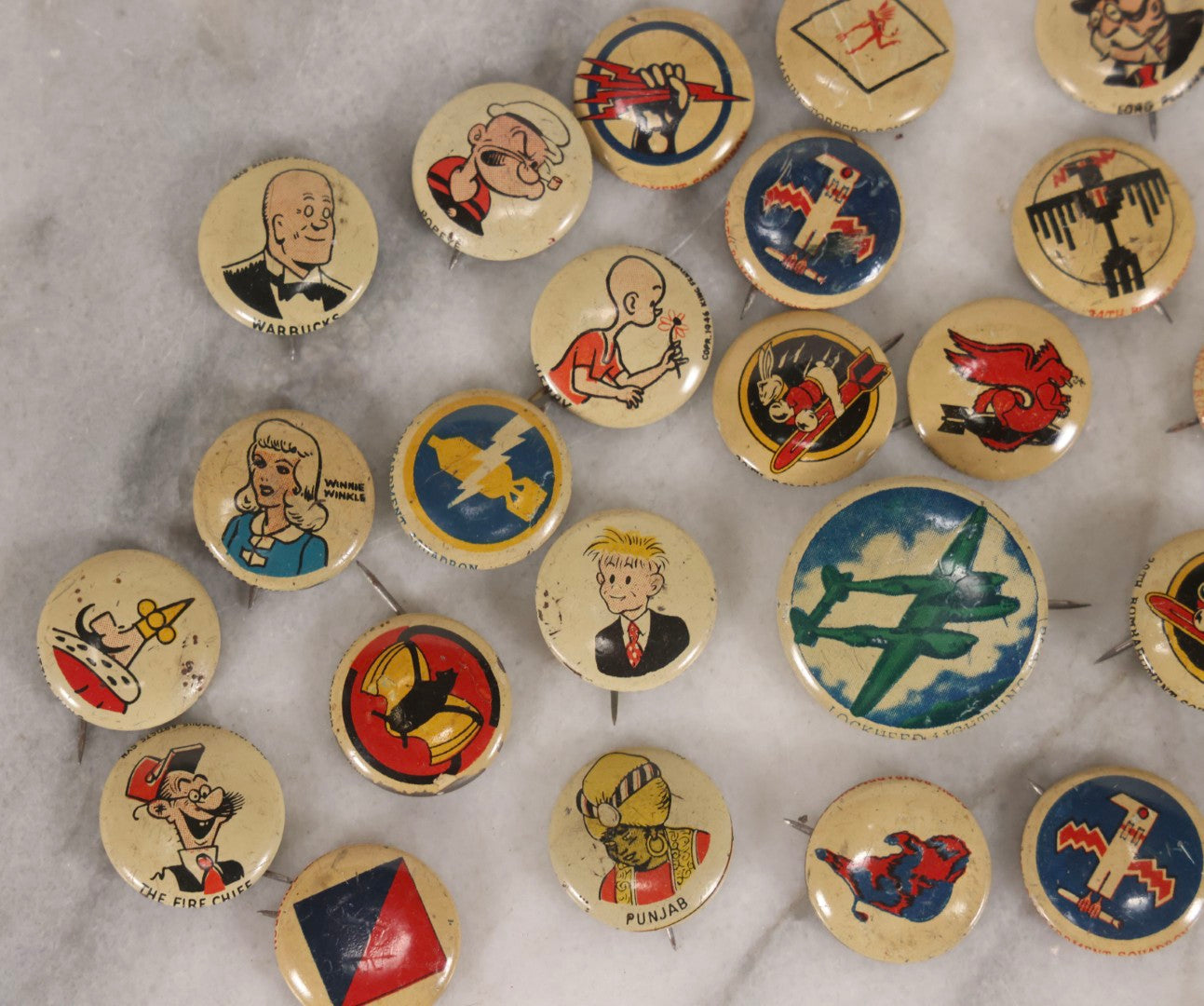 Lot 187 - Grouping Of 30 Vintage Kellogg's Pep Cereal Pinback Buttons Featuring Comic Strip Characters Like Popeye And Lord Pushbottom And World War II Military Insignia, Copyright 1946