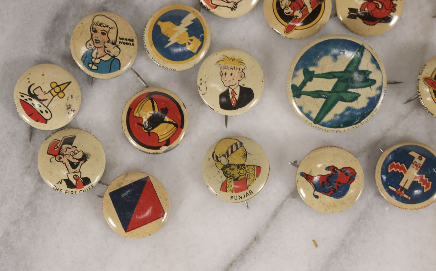 Lot 187 - Grouping Of 30 Vintage Kellogg's Pep Cereal Pinback Buttons Featuring Comic Strip Characters Like Popeye And Lord Pushbottom And World War II Military Insignia, Copyright 1946