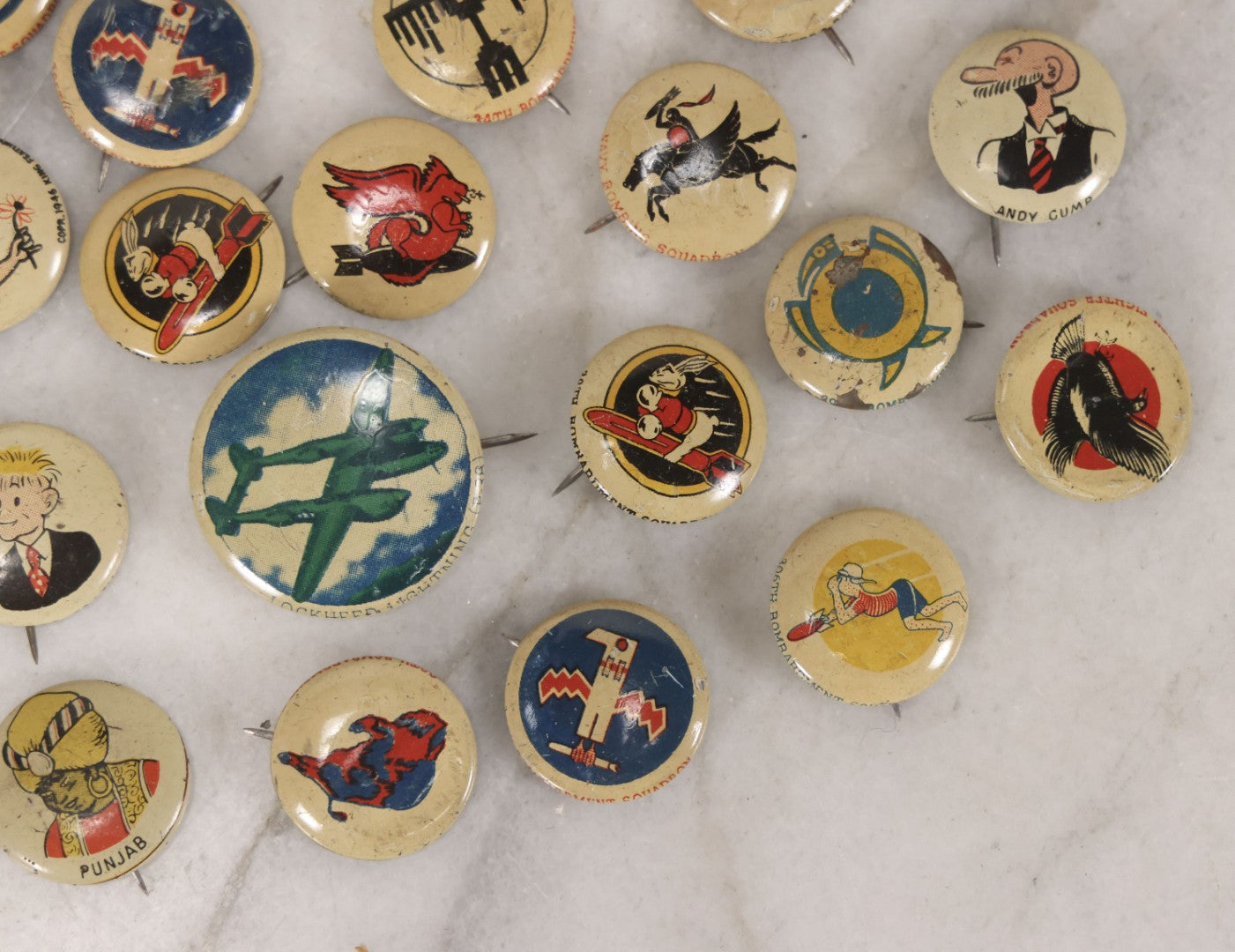 Lot 187 - Grouping Of 30 Vintage Kellogg's Pep Cereal Pinback Buttons Featuring Comic Strip Characters Like Popeye And Lord Pushbottom And World War II Military Insignia, Copyright 1946