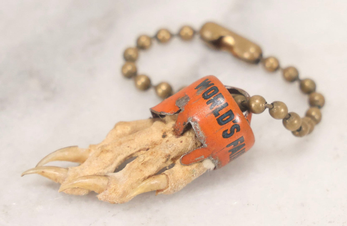 Lot 188 - Vintage 1939 New York World's Fair Lucky Rabbit's Foot Keychain With Tin Lithograph Mount Depicting Trylon And Perisphere