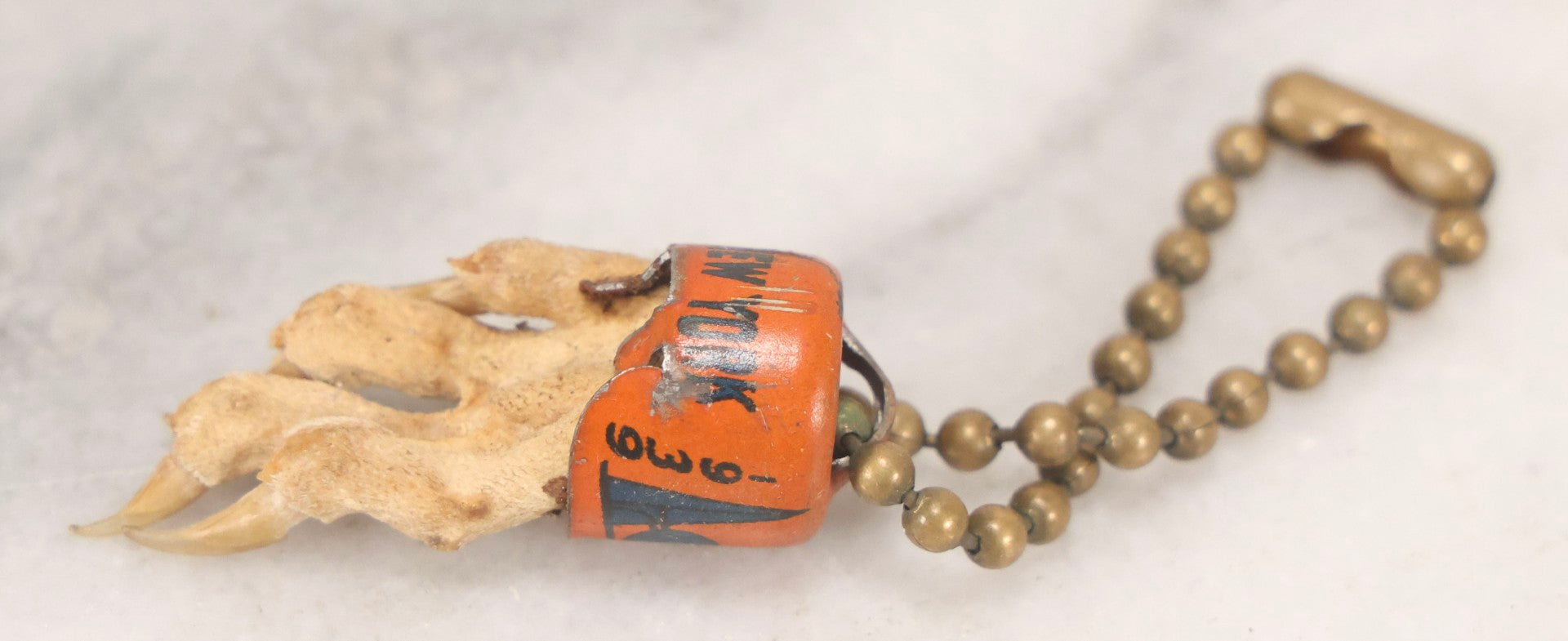Lot 188 - Vintage 1939 New York World's Fair Lucky Rabbit's Foot Keychain With Tin Lithograph Mount Depicting Trylon And Perisphere