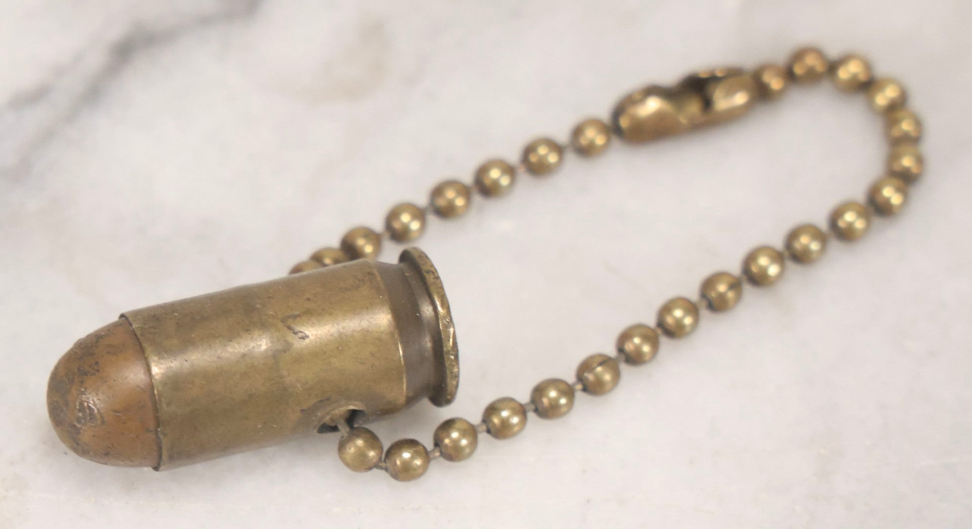 Lot 189 - Trio Of Vintage Bullet Novelties Including Two Bullet Keychains And “Lone Ranger” Toy Bullet