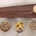 Lot 190 - Grouping Of Four Vintage Gold-Toned Masonic Pins With Compass And Square, Including Stick Pin In Leather Case And 25-Year Pin