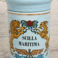Lot 052 - Vintage Mid Century Reproduction Porcelain Apothecary Jar “Scilla Maritima” (Drimia Maritima) With Blue Decoration, Gold Pin Striping, And Applied Lion Motif, Fantasy Item, Not Antique, 10-1/2" H