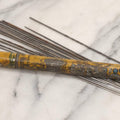 Lot 054 - Antique Gloria Brand Highly Tempered Steel Knitting Pins In Original Tin Lithograph Tube With Woman's Face Motif, Made In Germany, 9-3/4" L