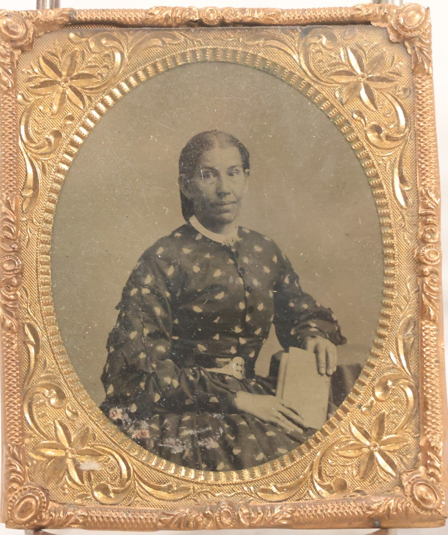 Lot 130 - Antique 1/6th Plate Tintype Photograph Of Seated Woman Holding Book, With Brass Mat And Preserver, No Case