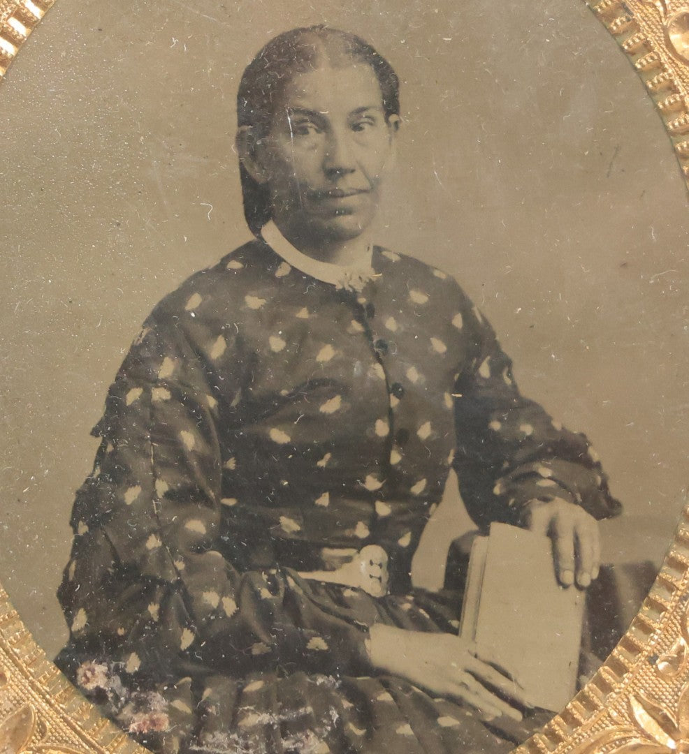 Lot 130 - Antique 1/6th Plate Tintype Photograph Of Seated Woman Holding Book, With Brass Mat And Preserver, No Case