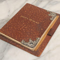 Lot 019 - Antique Leather-Covered Prescription Pad Belonging To Charles A. Carlton, M.D., Salem, Massachusetts, With Decorative Sterling Silver Corners And Unused Prescription Paper