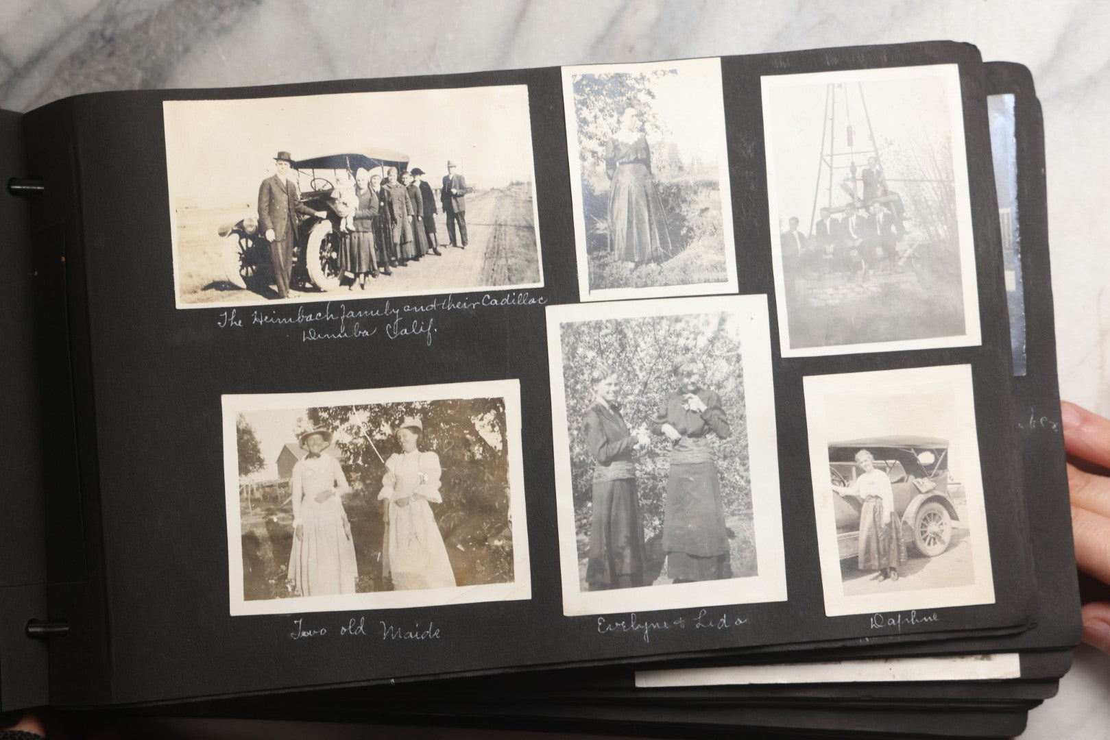 Lot 025 - Antique Snapshot Photo Album Gifted To Zella On Christmas 1916 With 1750+ Photos Of Midwest And Western Scenes Including Telluride & Greeley Colorado, Farm Life, Animals, Automobiles, Oil Wells, Early Aviation, And WWI Soldiers, 1916–1920
