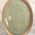 Lot 039 - Antique Brass Oval Photo Frame With Whirling Logs Motif By Kronheimer & Oldenbusch K & O Co., 4-3/8" x 5-3/4"