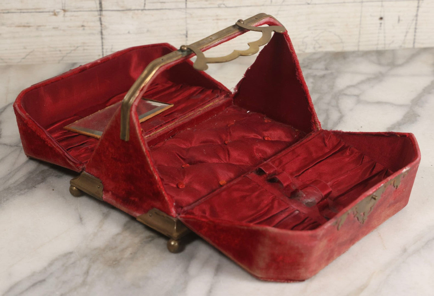 Lot 044 - Antique Rigid Red Velvet Ladies' Purse With Fold-Down Sides, Interior Mirror, Tufted Cushion, And Upholstered Interior