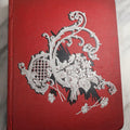 Lot 079 - Antique Red Scrapbook Album With Silver Painted Embossed Decorations, Hamburg, Stockholm, Paris, England, Stratford-On-Avon, Scotland, Liverpool Ephemera, Two Full Spreads Homemade Herbarium, Circa 1896
