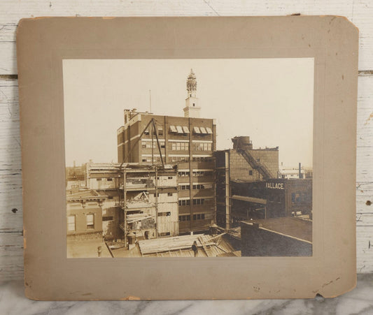 Lot 140 - Antique Boarded Photograph Of Urban Construction Scene With Multi-Story Buildings, Rooftop Water Tank, And “Wallace” Sign Visible