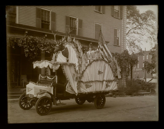 Lot 148 - Vintage Glass Plate Photographic Negative Of Parade Float Decorated With American Flags, Pennants, And Bunting Featuring Woman As Statue Of Liberty And Taxidermy Mount On The Street