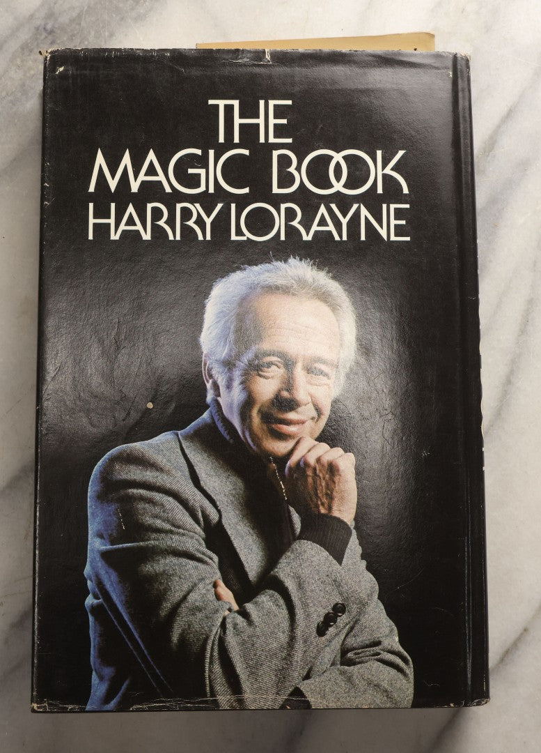 Lot 105 - Grouping Of Three Vintage Magic Books With Dust Jackets Including "The Magic Book" By Harry Lorayne, "The Dai Vernon Book Of Magic" By Lewis Ganson, And "Routined Manipulation Finale" By Lewis Ganson, Circa 1960s-1970s