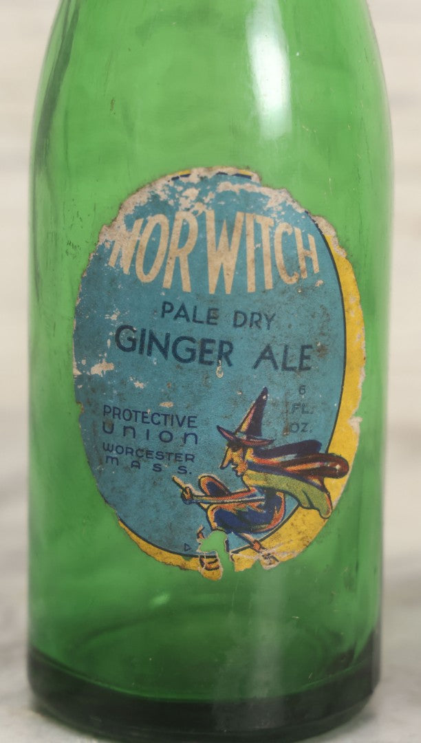 Lot 045 - Vintage Norwitch Pale Dry Ginger Ale Green Glass Soda Bottle With Witch Label, Protective Union, Worcester, Massachusetts, Early 20th Century