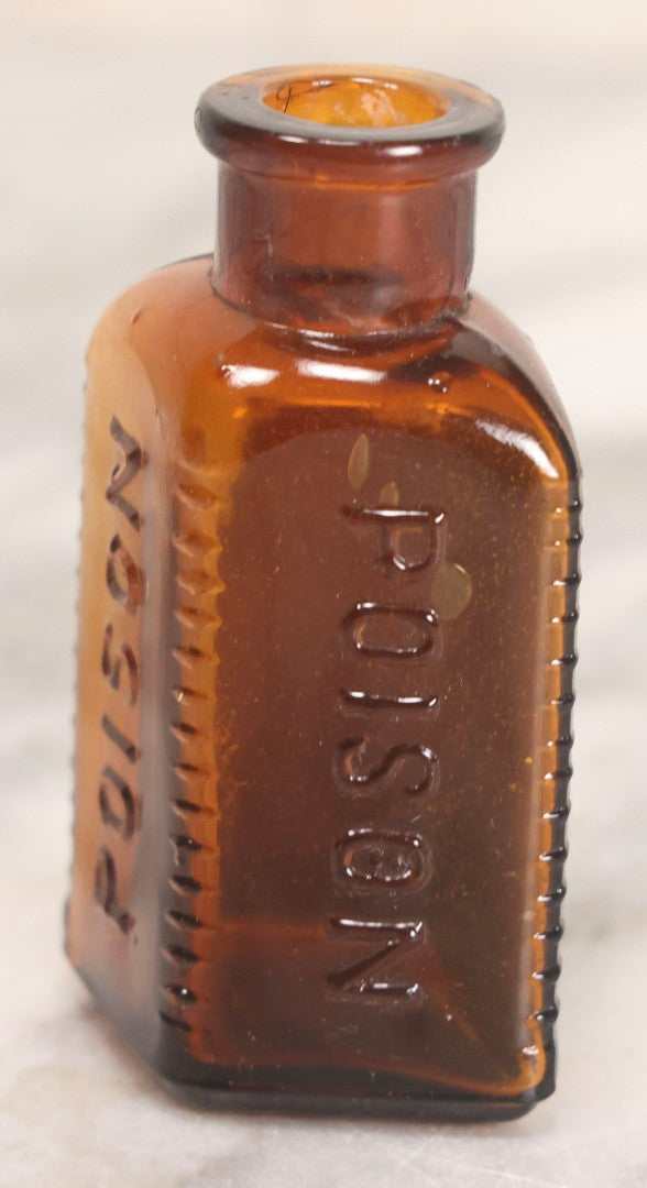 Lot 084 - Amber Poison Bottle With Poison Ribs, Tartar Emetic Paper Label, Eli Lilly & Co., Indianapolis, Indiana