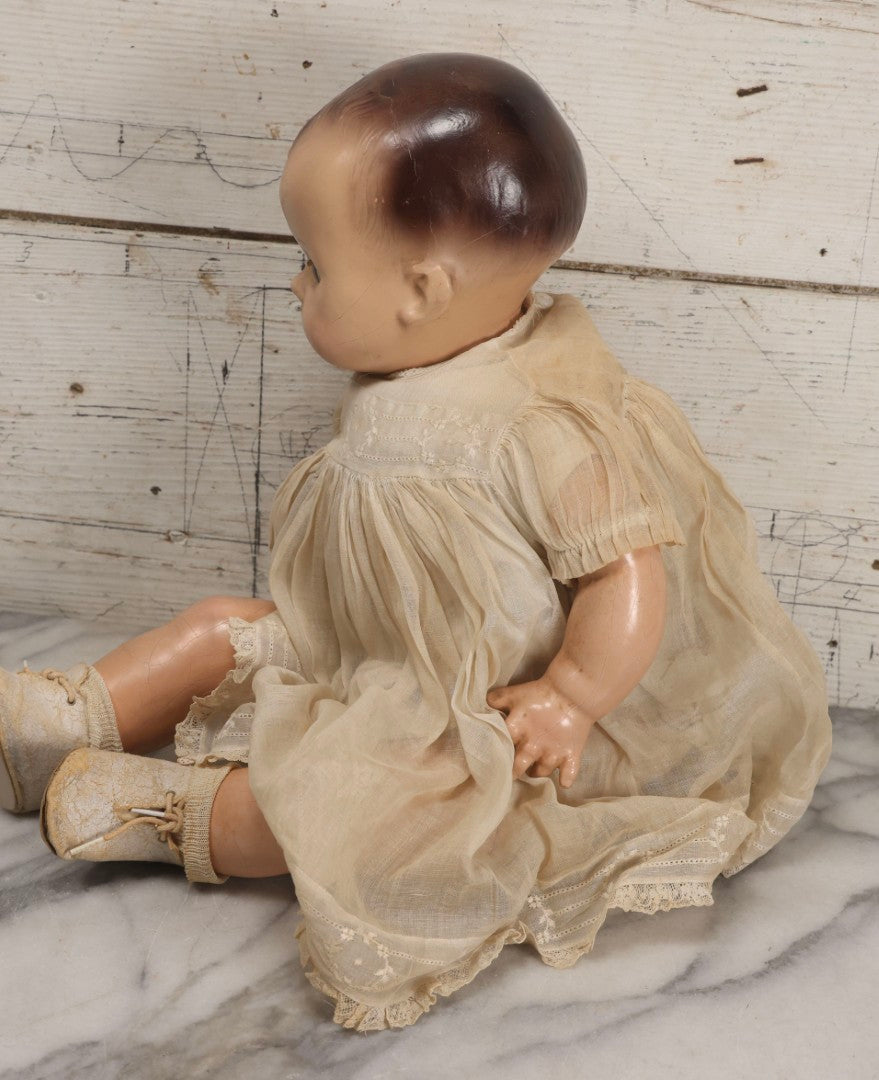 Lot 092 - Vintage Composition Baby Doll With Blue Sleep Eyes, Brown Hair, And Original Outfit